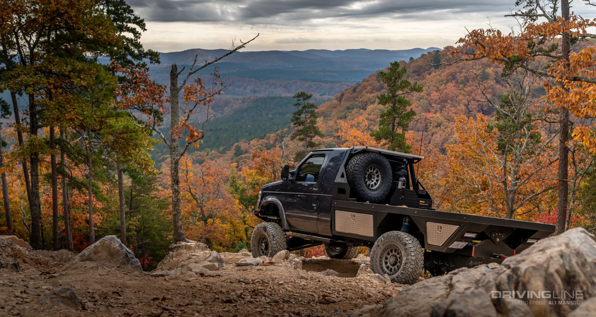 Rear driver side of 2021 Ford E350 4x4 flatbed cutaway van ujoint offroad