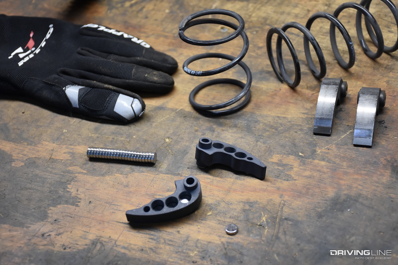 Clutch parts on table for polaris rzr with Nitto gloves