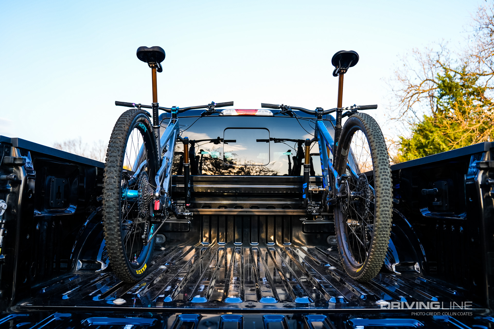 A RockyMounts bolt in track system in the bed of this Ford F-150 allows two bikes to be stored in the bed with driveshaft mounts, both protecting them from being damaged in transport and preventing them being stolen as well.