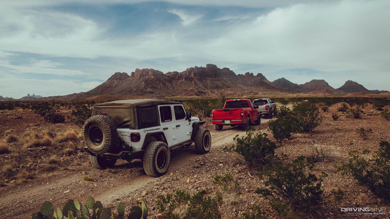 three off-road vehicles exploring black gap trail