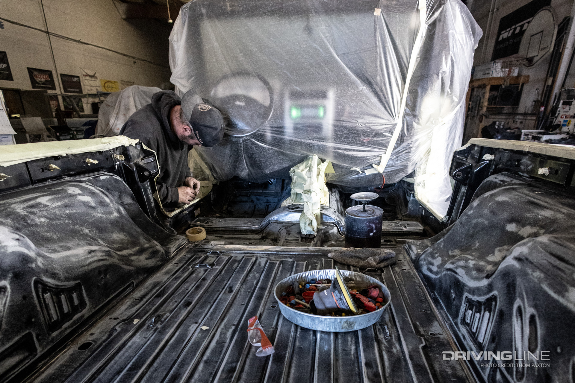 prepping a Jeep LJ for the spray on insulation coating process.