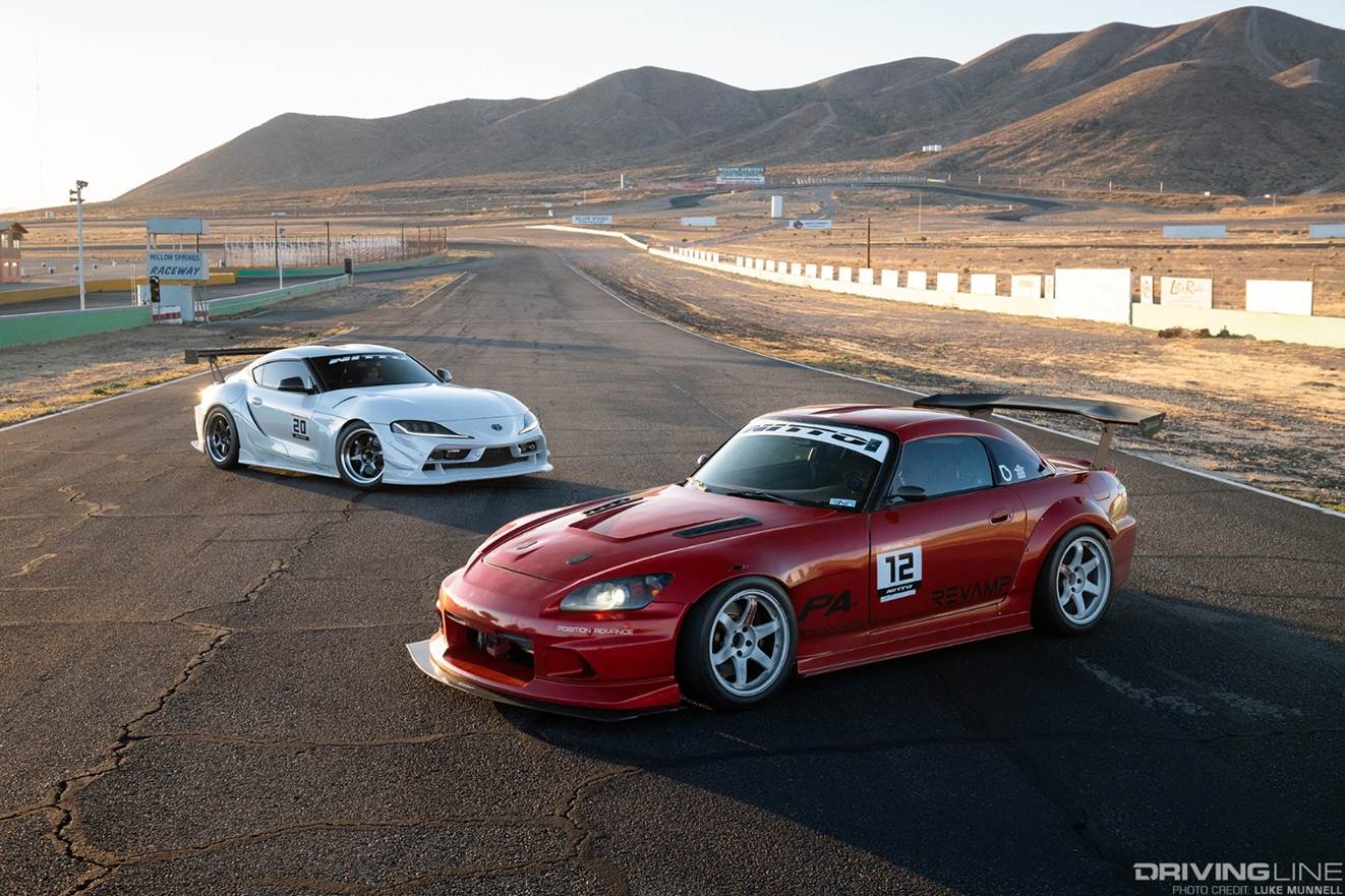 honda s2000 vs toyota supra at racetrack