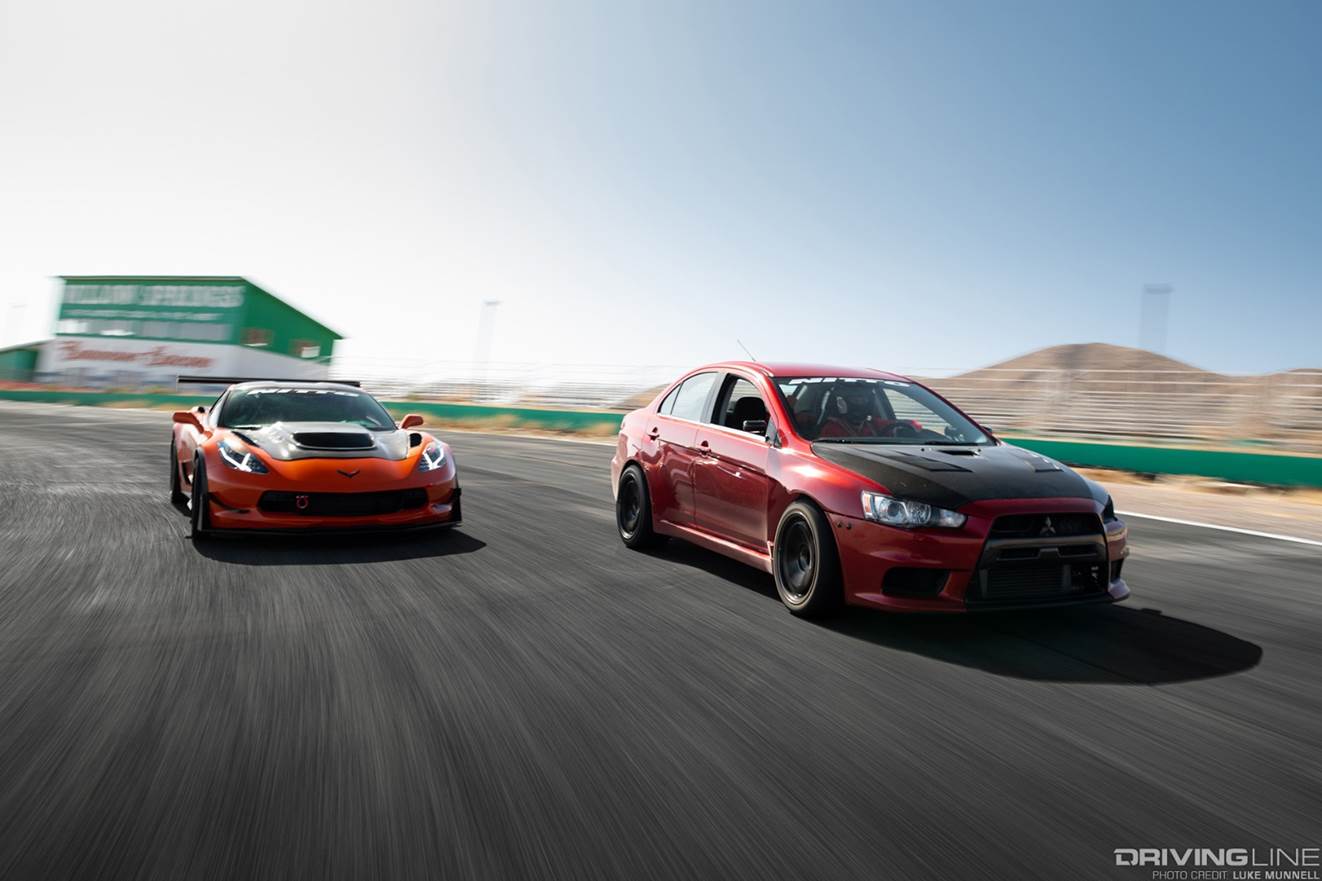 corvette z06 and mitsubishi evo x racing at willow springs