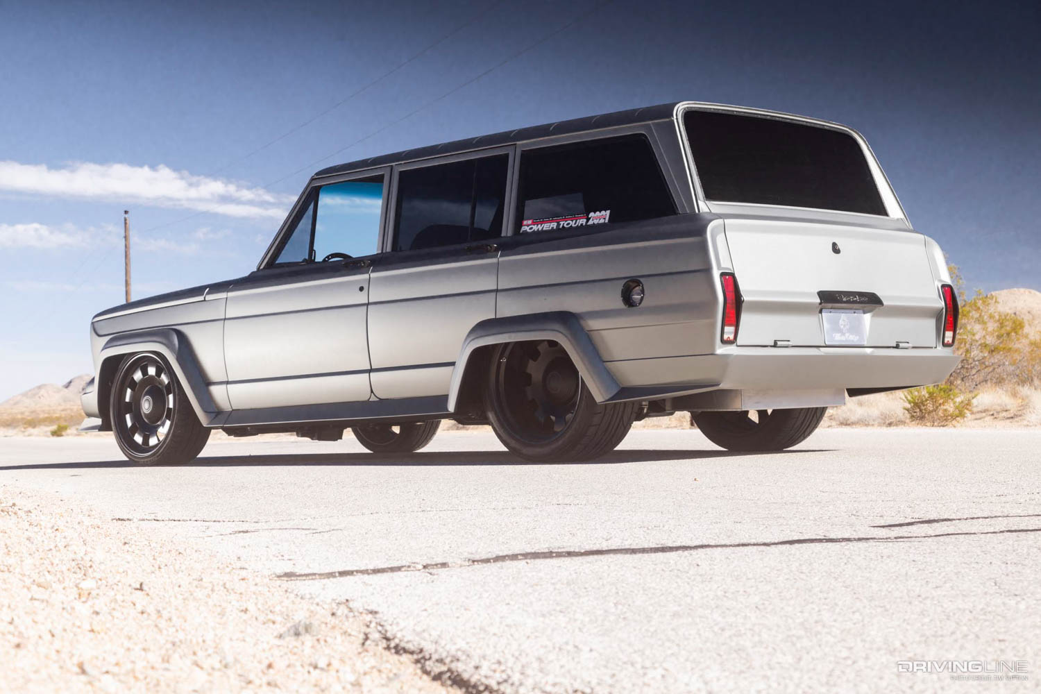 rear driver side lowered 1975 Jeep Wagoneer on Nitto NT555 G2 tires