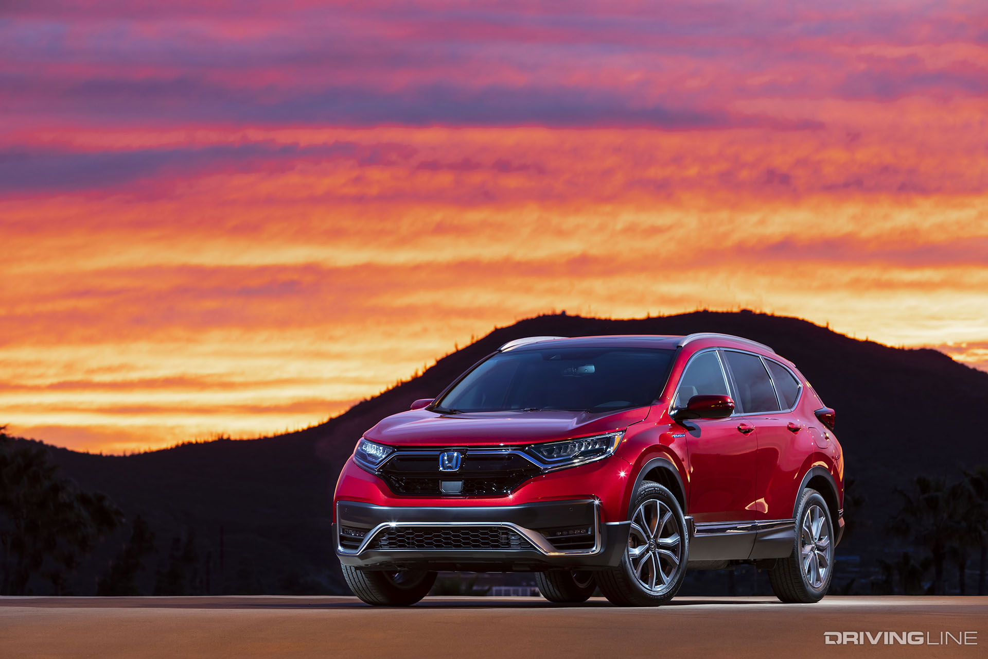 Honda CR-V Hybrid 2020 with the sunset behind it