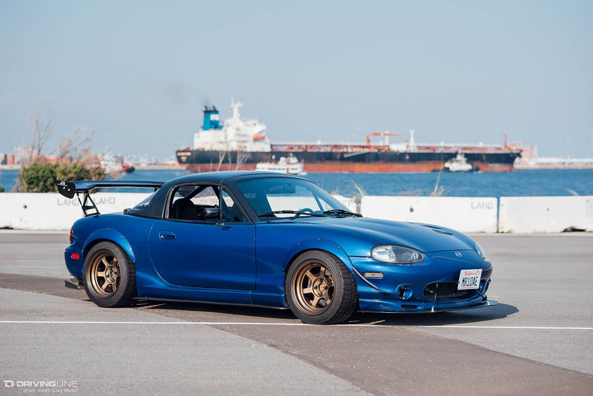 NB Miata with a wing on Nitto NT05 tires