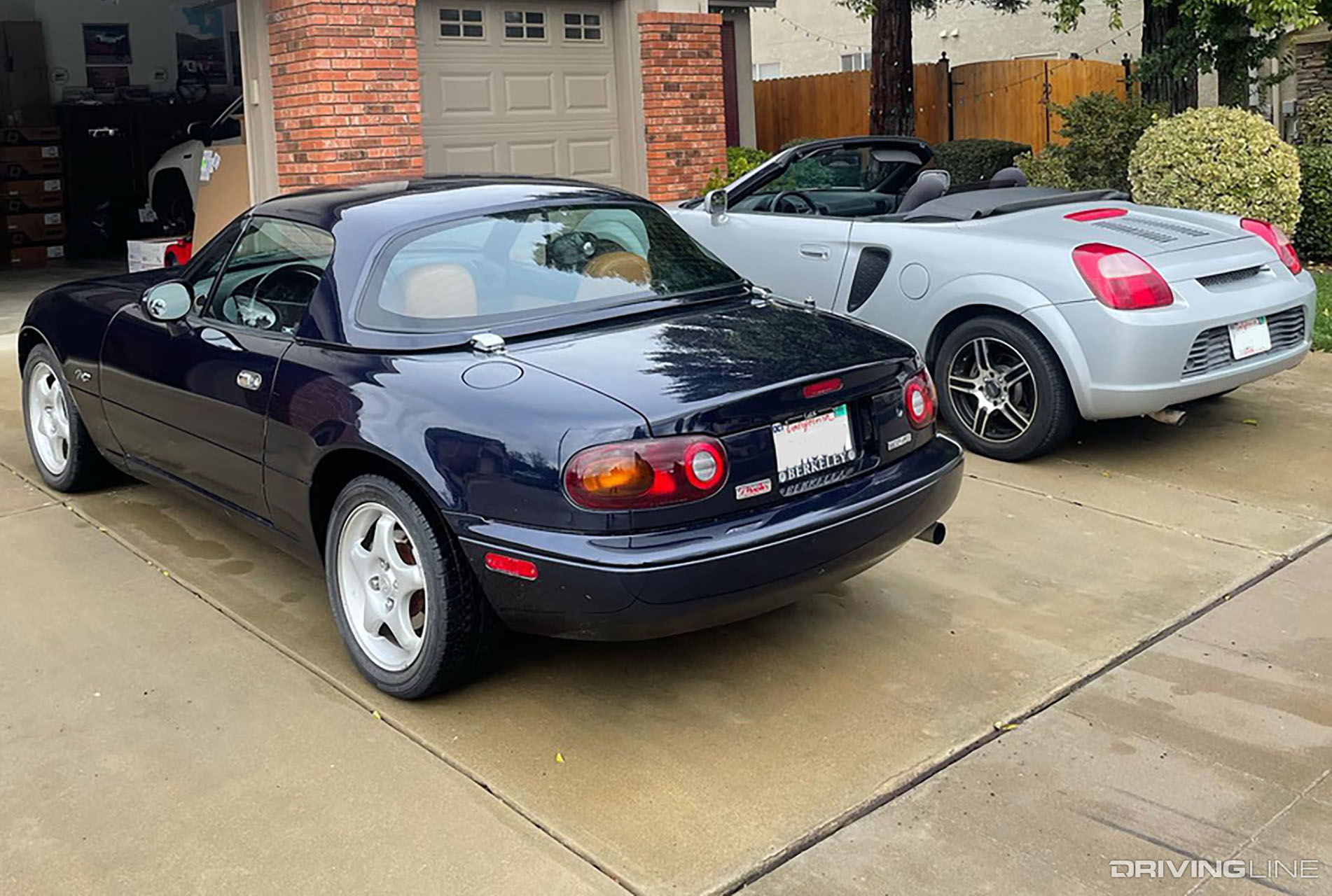 Toyota MR2 Spyder and NA Miata in a driveway