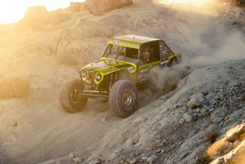 Erik Miller driving down a dirt hill