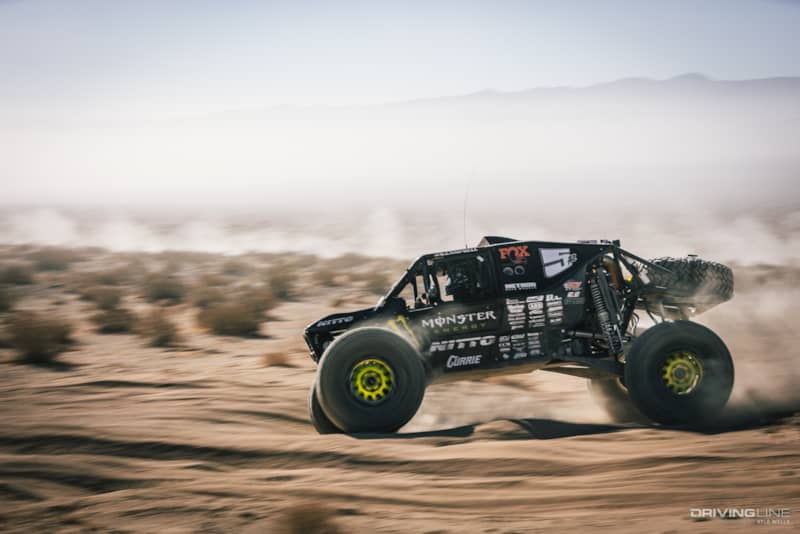 Shannon Campbell driving through the desert