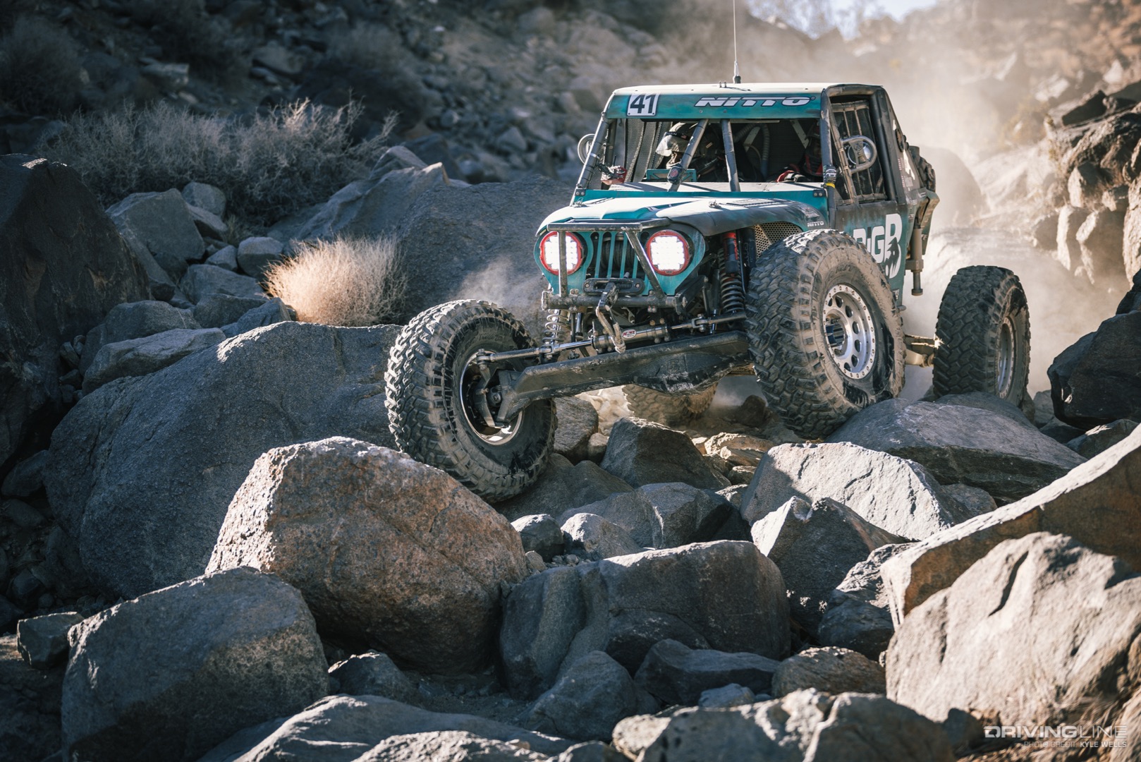 Josh Blyler driving over boulders