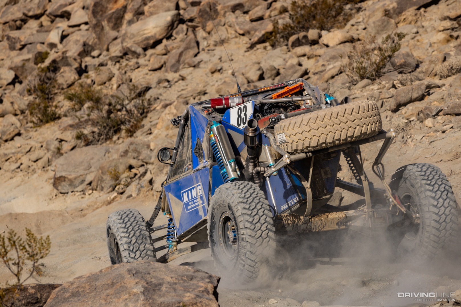 Raul Gomez driving down a rocky trail