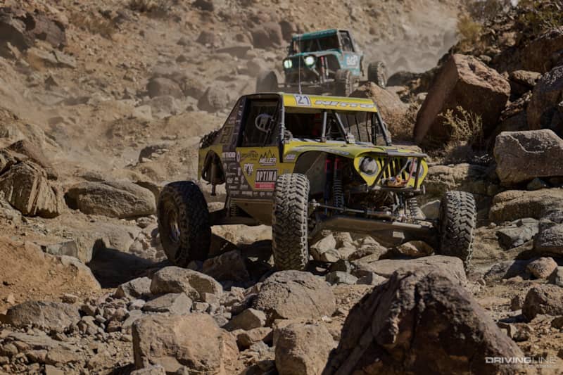 Erik Miller drives through a rocky canyon ahead of Josh Blyler