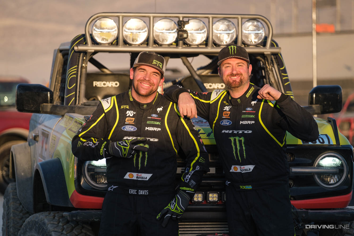Vaughn Gittin Jr and co driver in front of 4600 class Ultra4 racer