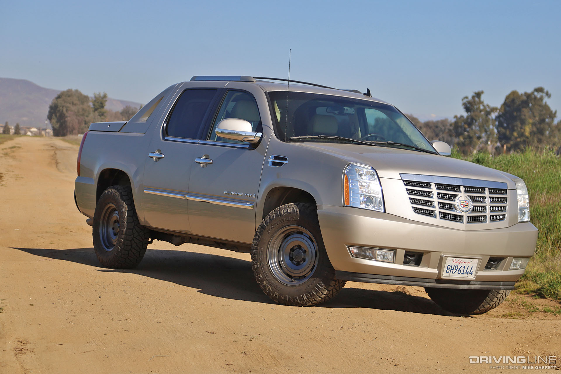Escalade EXT on Nitto Ridge Grappler and KMC Roswell