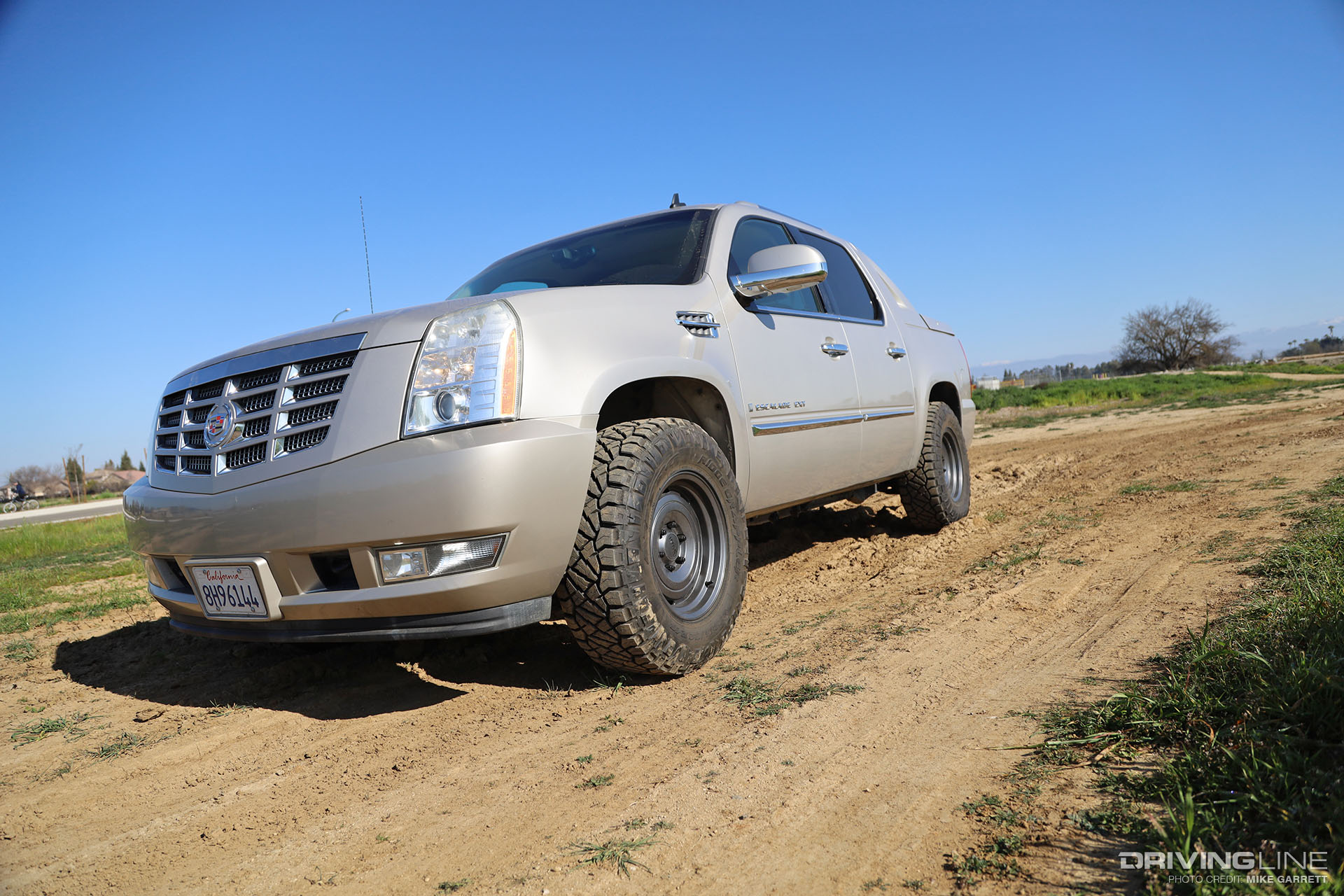 Escalade EXT on Nitto Ridge Grappler and KMC Roswell