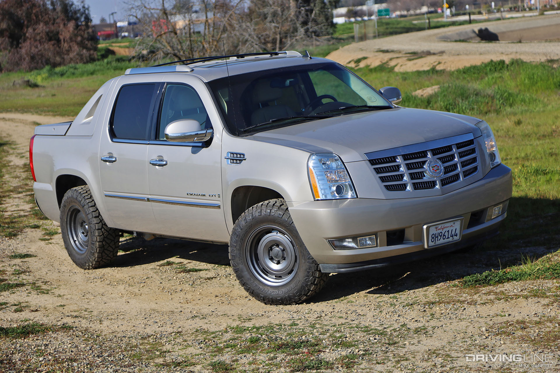 Escalade EXT on Nitto Ridge Grappler tires and KMC Roswell