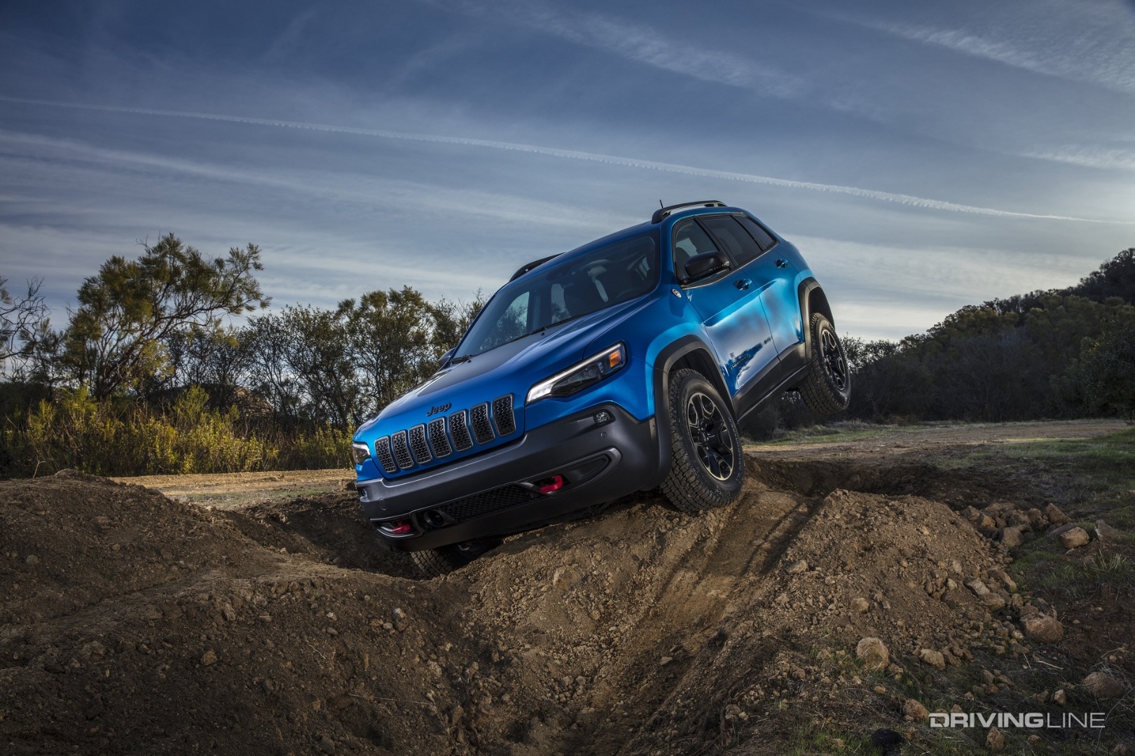 Jeep Cherokee Trailhawk blue front angle in ditch