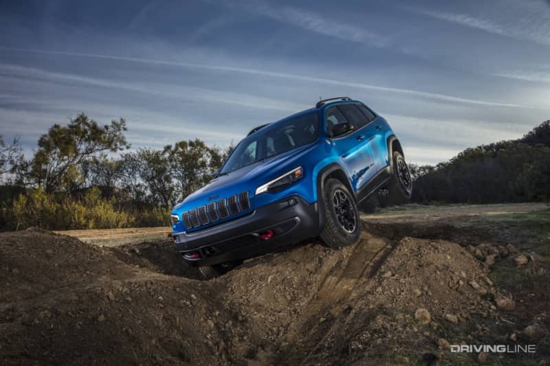 Jeep Cherokee Trailhawk blue front angle in ditch