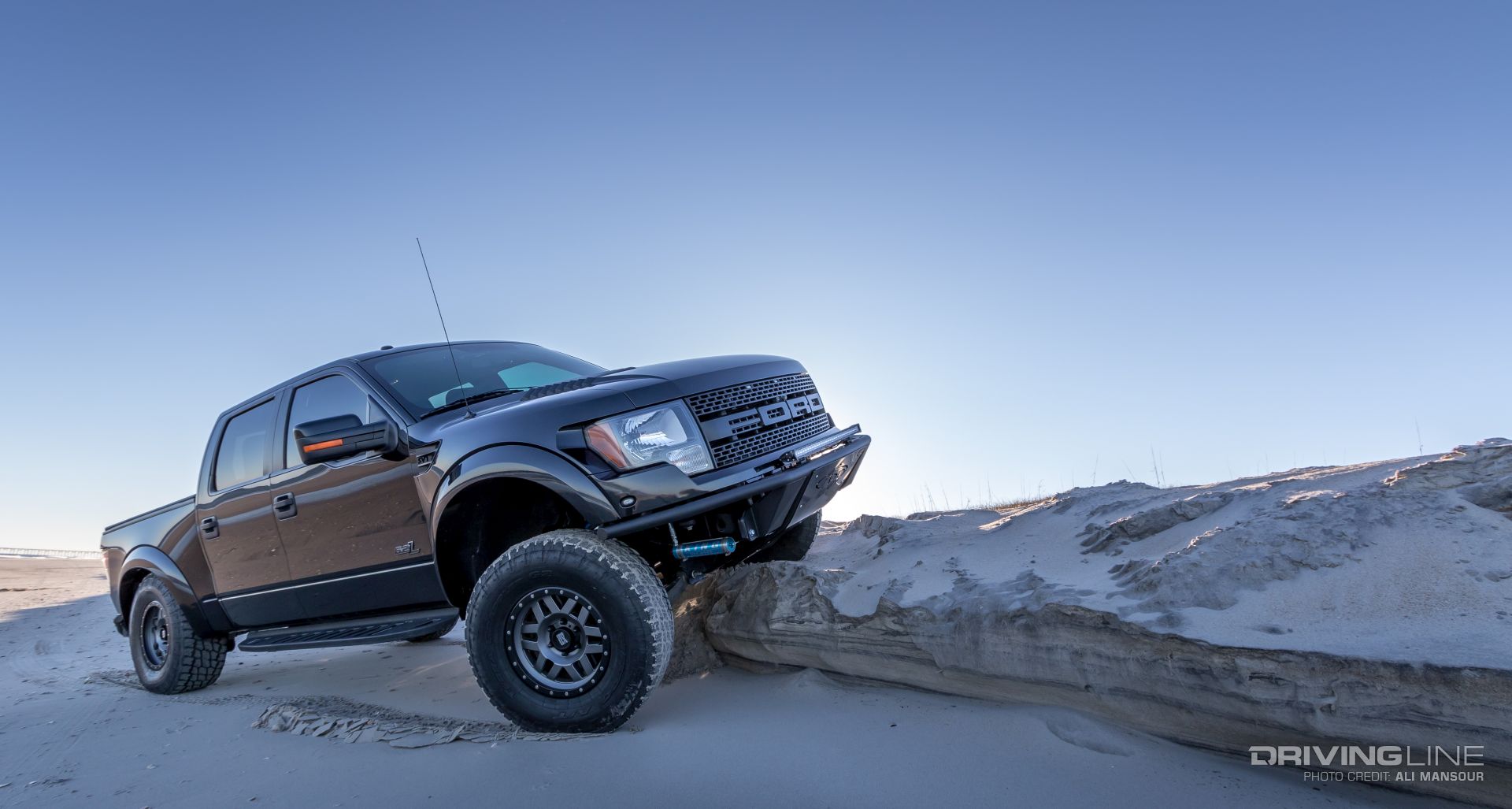 Ford F-150 SVT Raptor on Nittos climbing sand dune