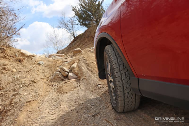 Off Road Nomad Grappler Nitto Tires on RAV4 going up a hill off-road