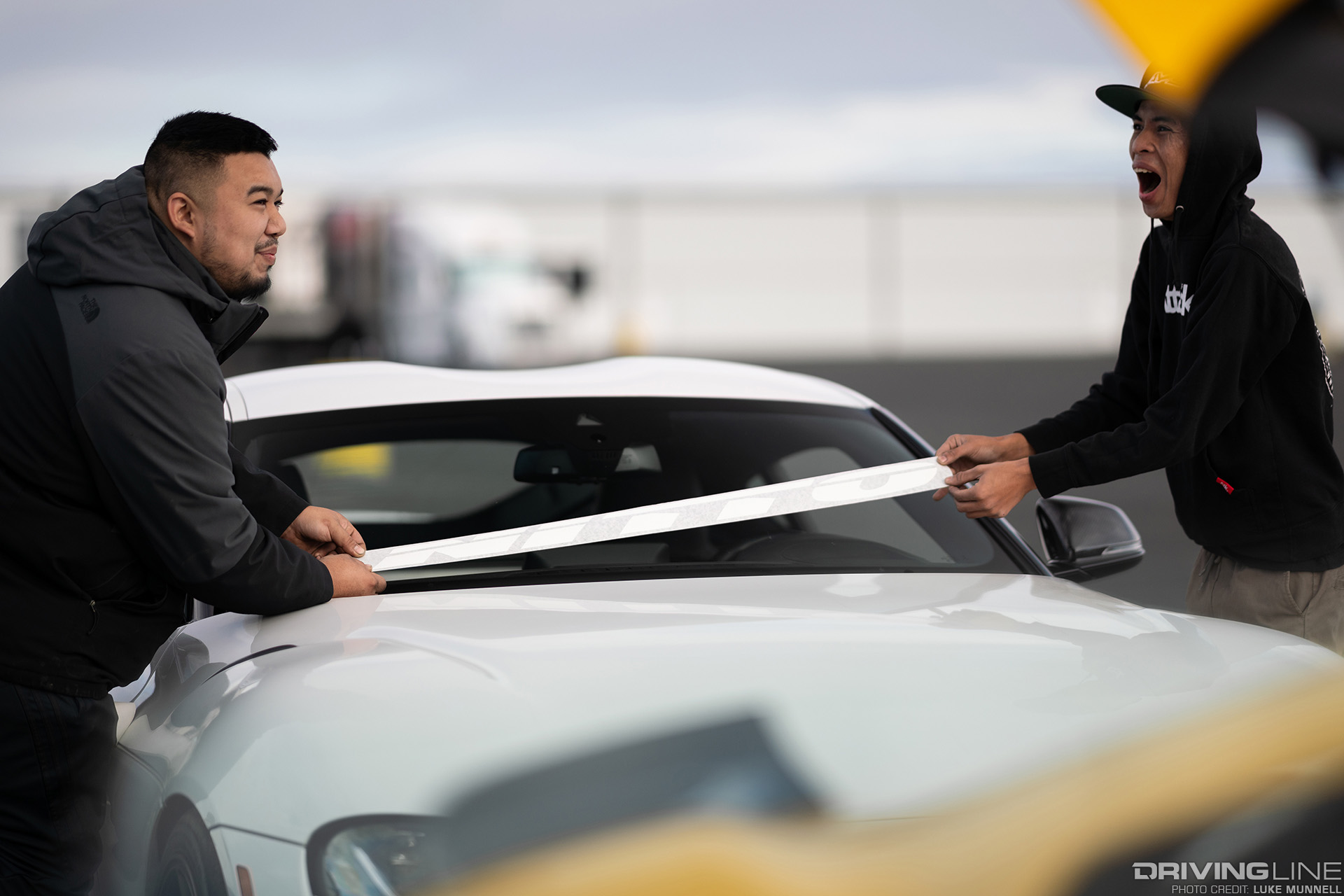 laying down nitto tire decal on supra windshield
