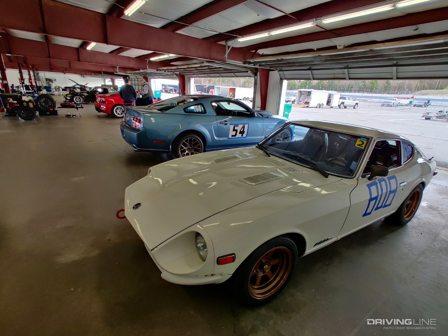 Ford Mustang and 280Z in garage at NHMS