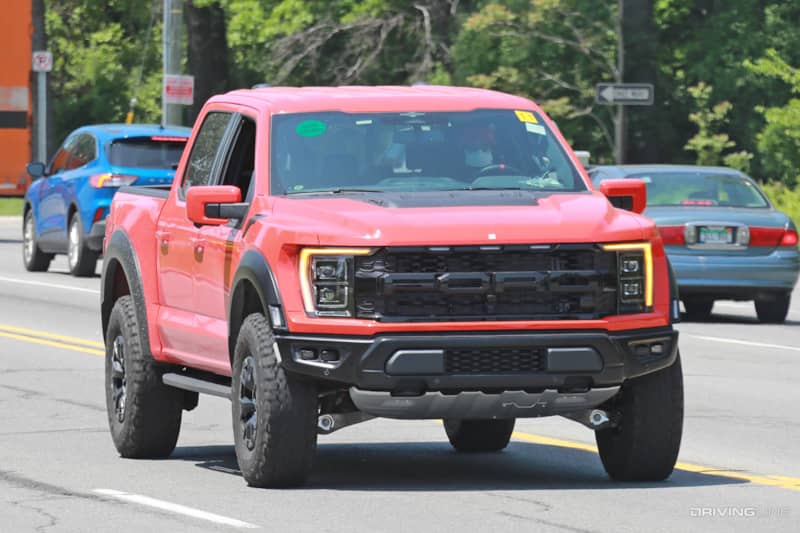 Front end of Ford F-150 Raptor R driving on street