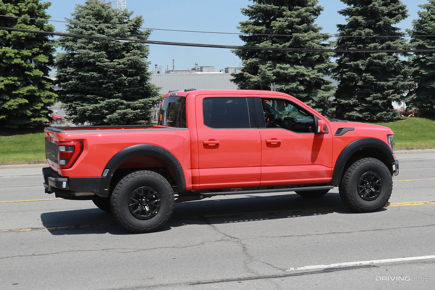 Spy Photos of Ford F-150 Raptor R side profile driving on street