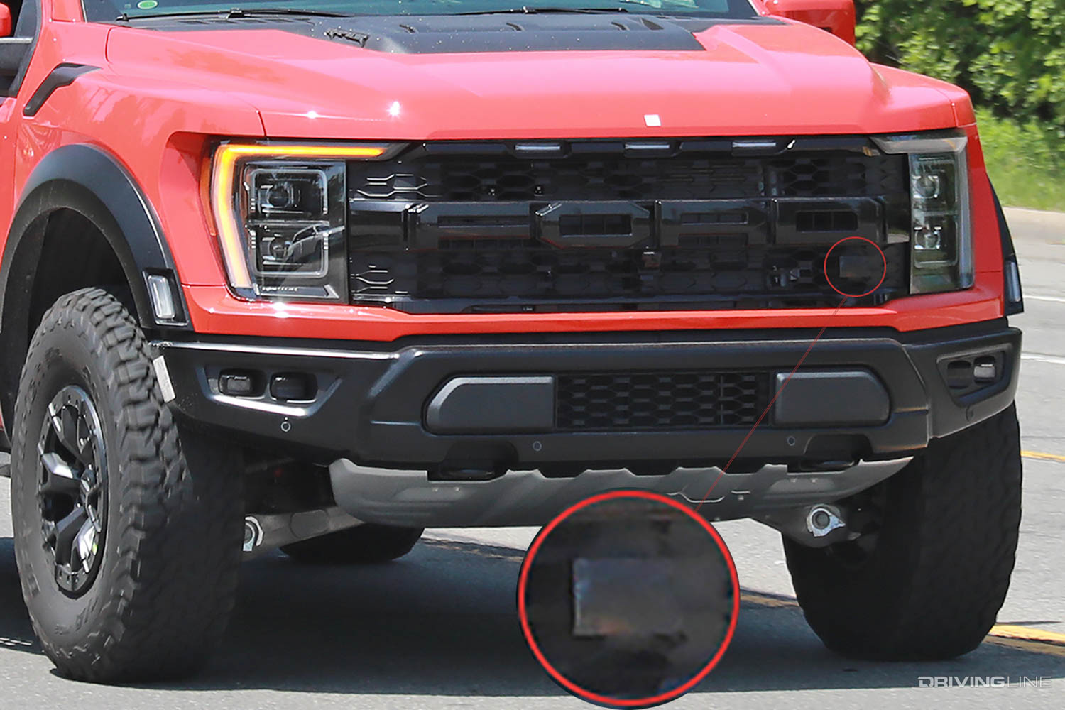 Front grille detail of Ford F-150 Raptor R with possible "R" placement covered in tape