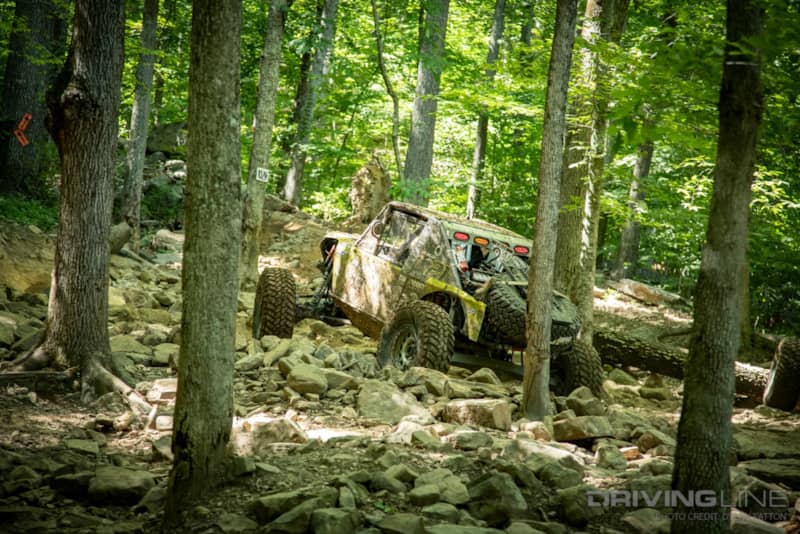 Eric Miller flying though the woods section