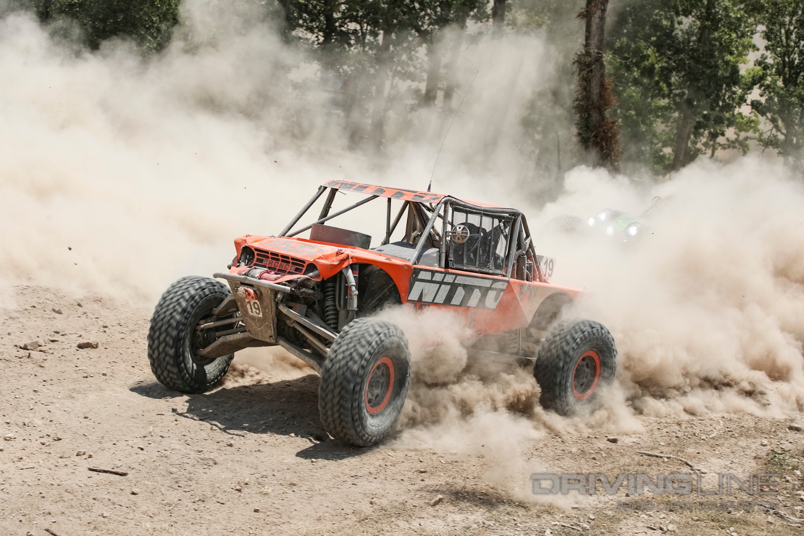 Paul Horschel trying to pull away from the competition in the dust filled course.