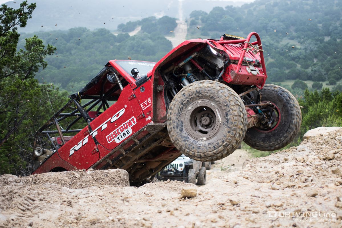 Jeep Wrangler JK on Nittos rock climbing in red