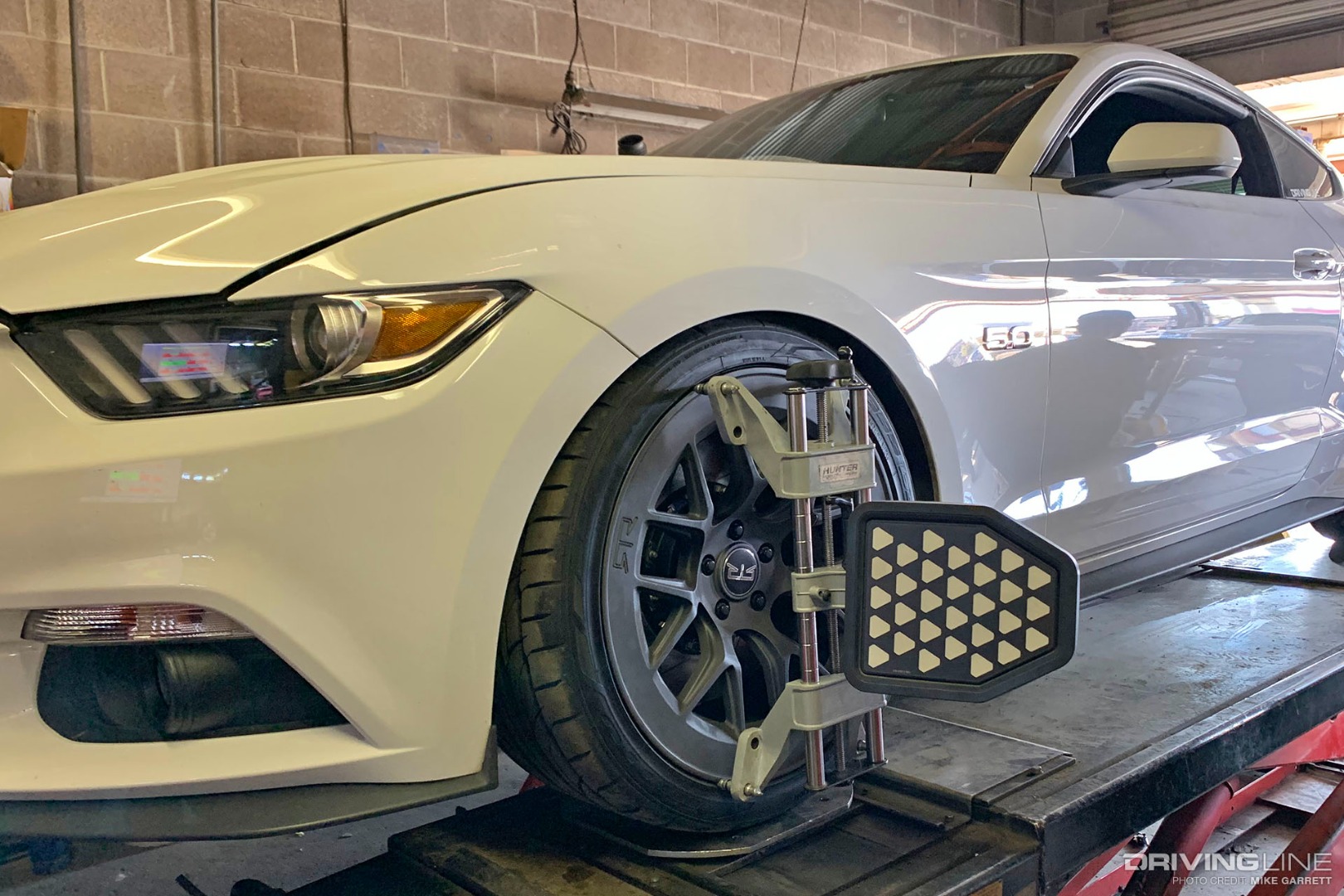 Ford Mustang on Nittos getting alignment