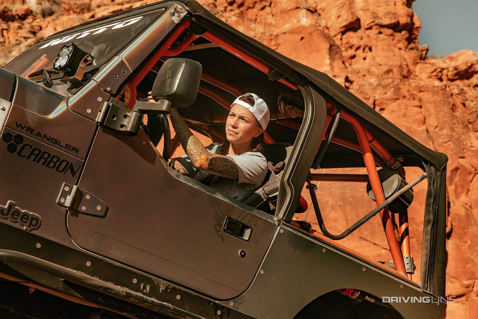 carbon off road jeep wrangler scaling rocks on nitto tires