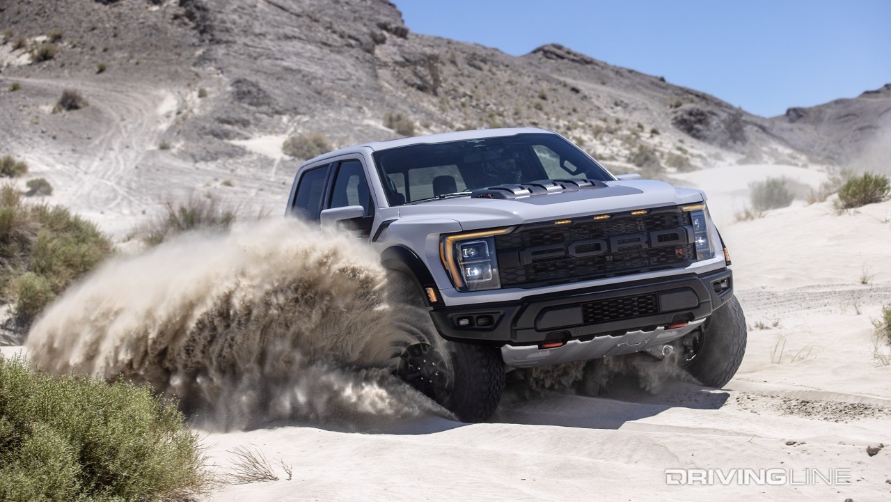 Ford F-150 Raptor R sideways bursting through sand