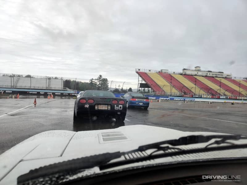 Waiting to enter pit lane in rain in Datsun 280Z WGI