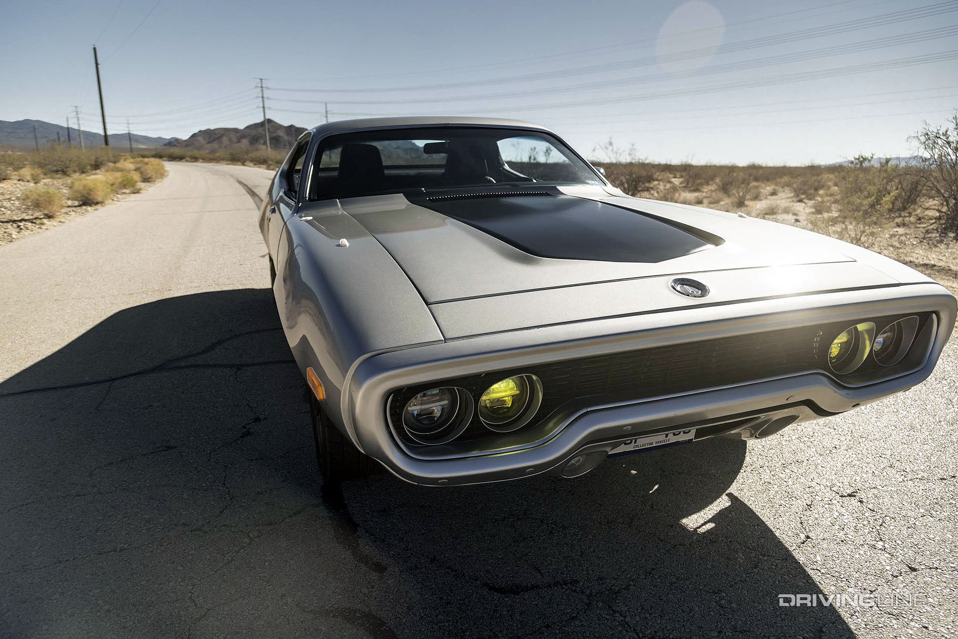 tesla s chrysler plymouth ev muscle car with nitto tires in desert