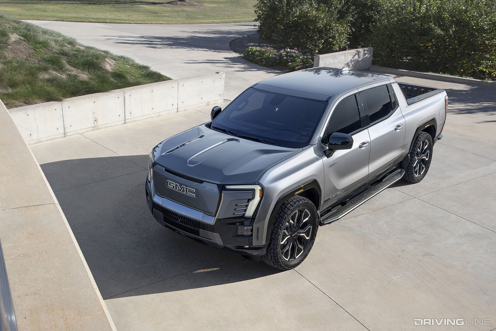 2024 GMC Sierra EV Denali in Driveway top driver side view