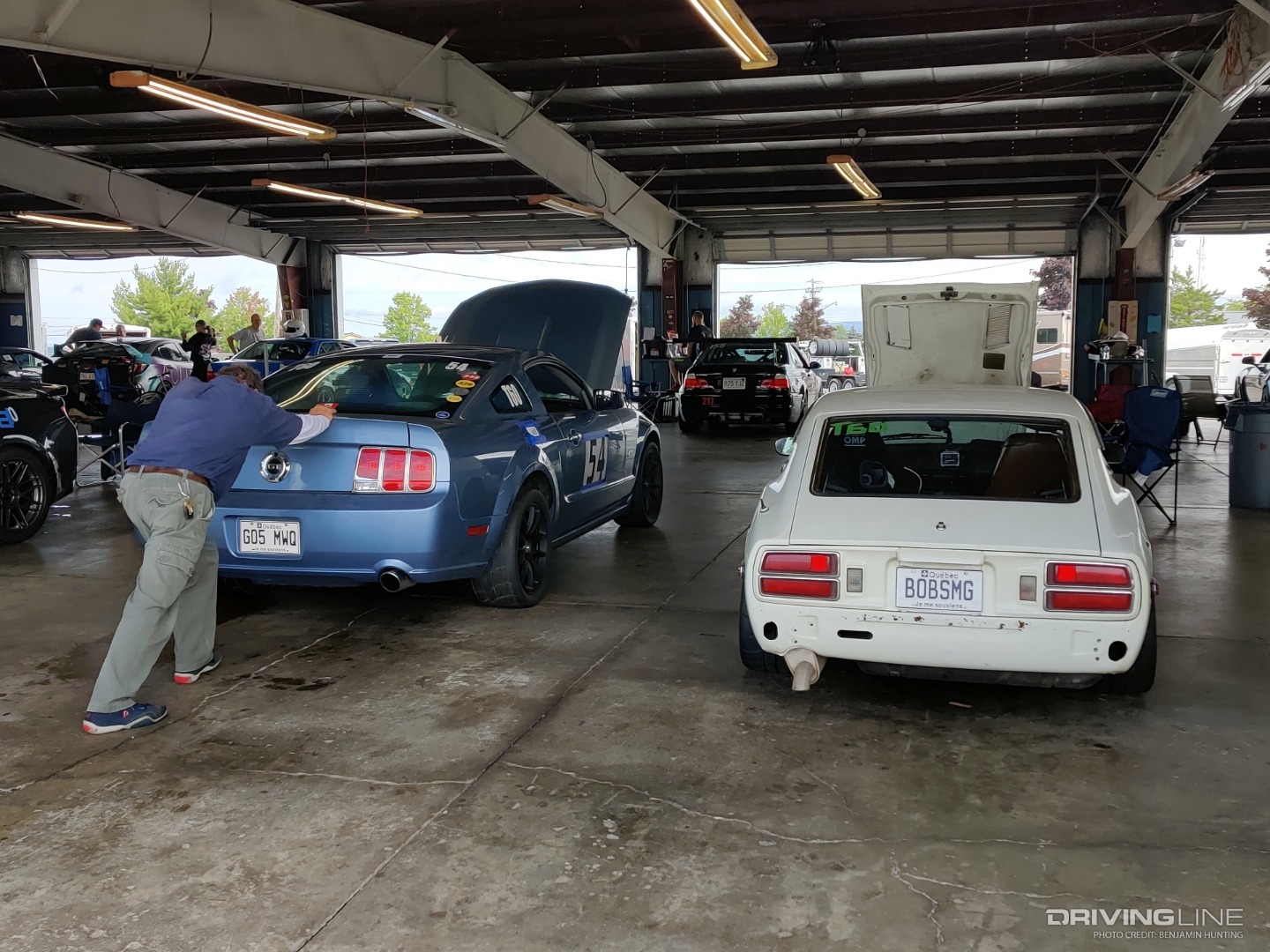 2005 Ford Mustang GT beside Datsun WGI