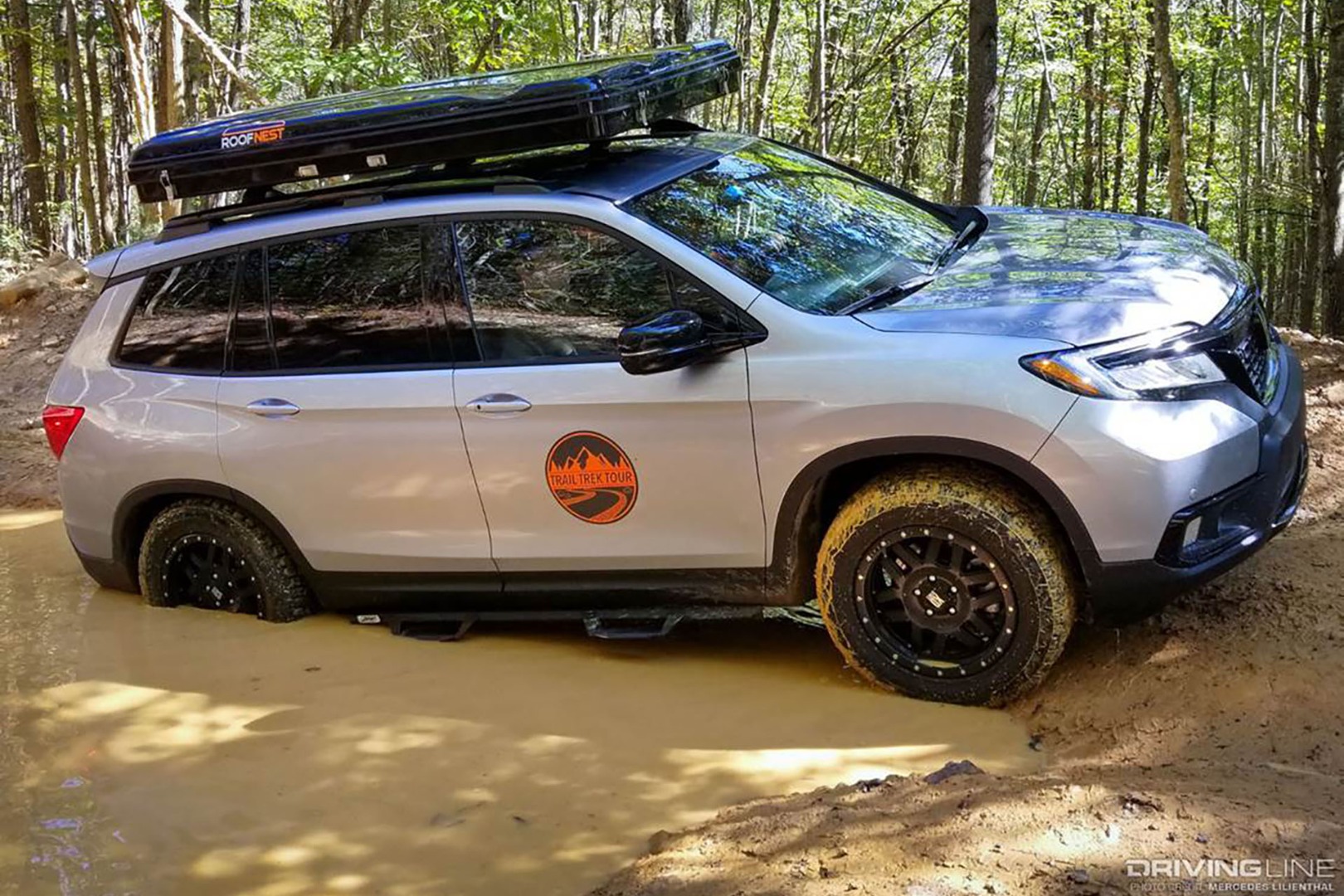 Honda crossover in mud pit