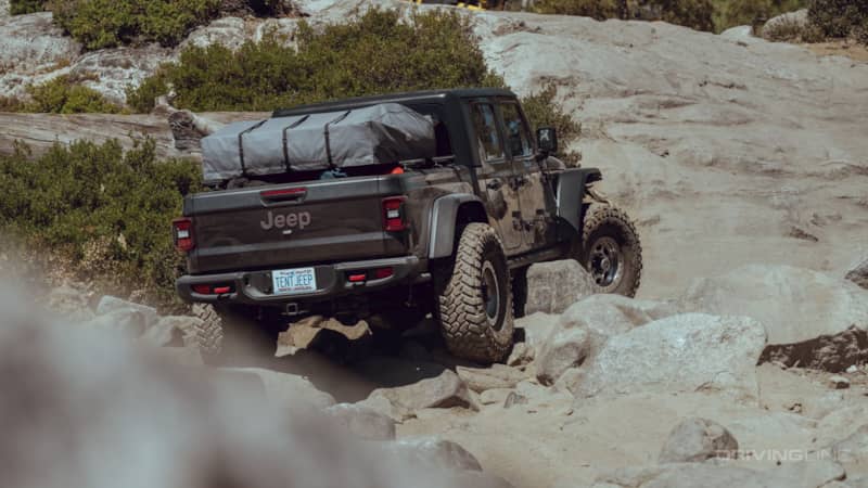 Rear view of off-roading Jeep Gladiator Rubicon Fox 30 Shocks DSC Review JT on 40s