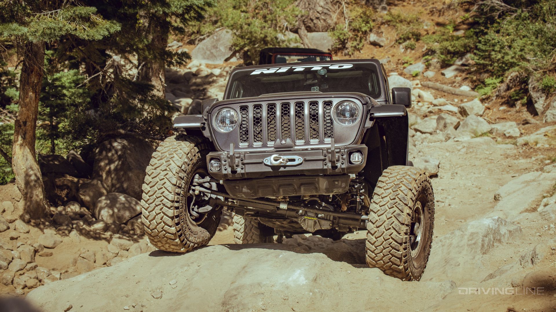 Factory skid plate on Jeep Gladiator Rubicon on 40-inch Trail Grappler tires
