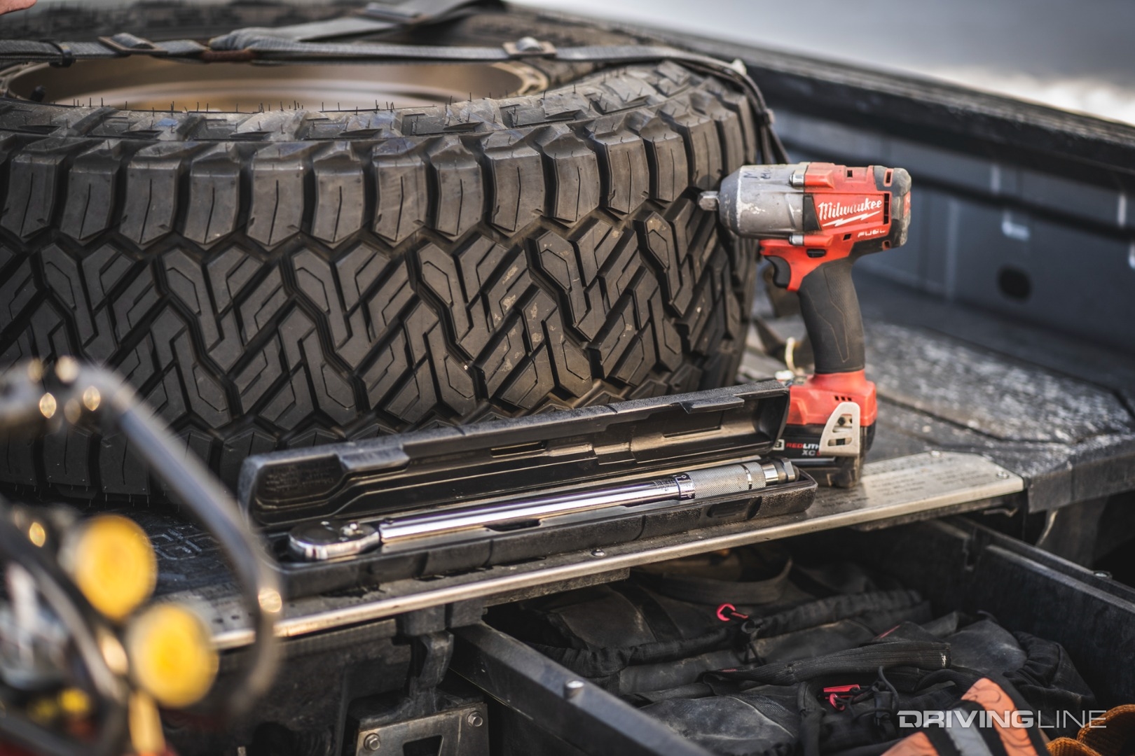 Spare tire with wrench and impact tool