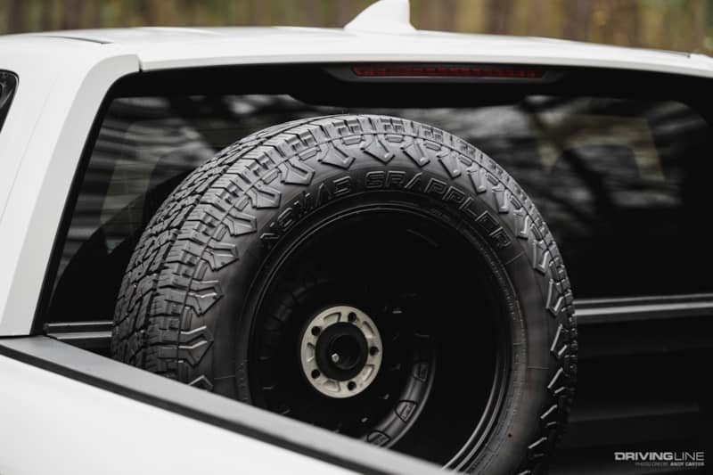 Nitto spare tire in bed of Ridgeline