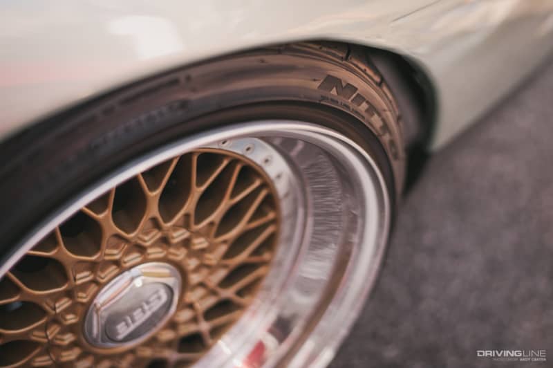 Lowered car on Nitto tires wheel in focus