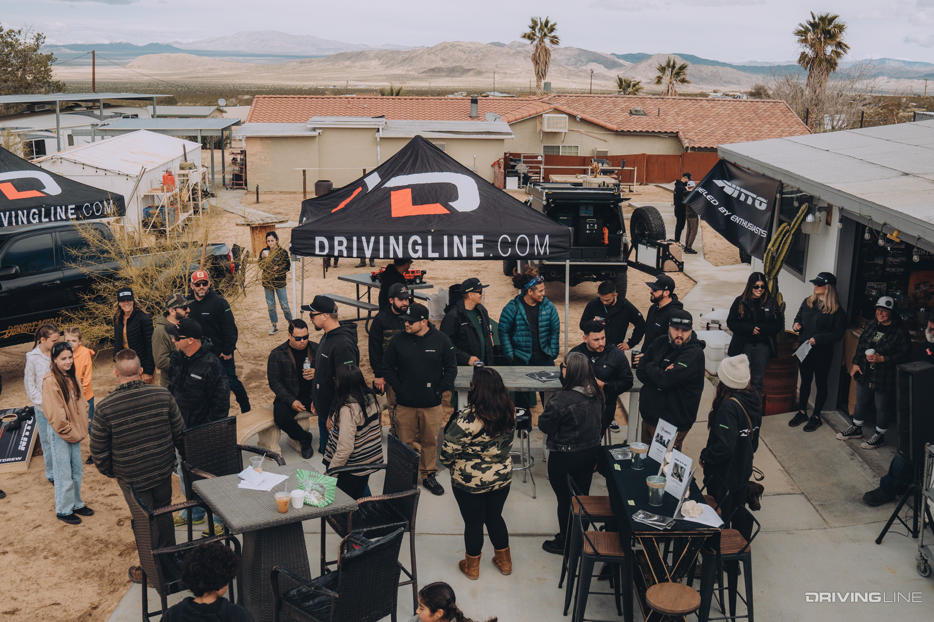 Crowd of people at Nitto Fastlane sponsored event in front of DrivingLine.com booth