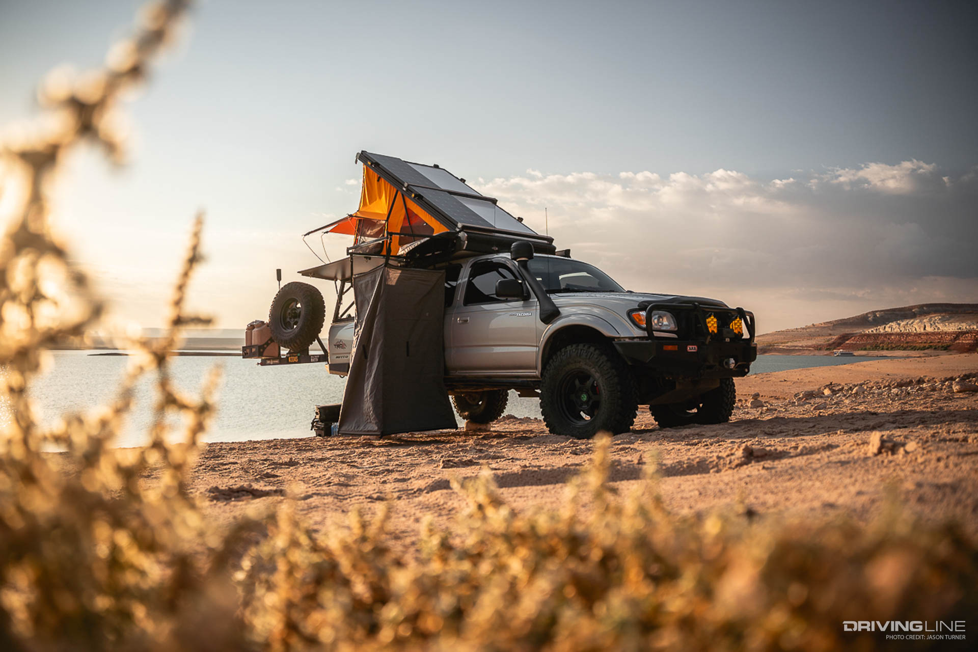 Toyota Tacoma Overlanding next to lake
