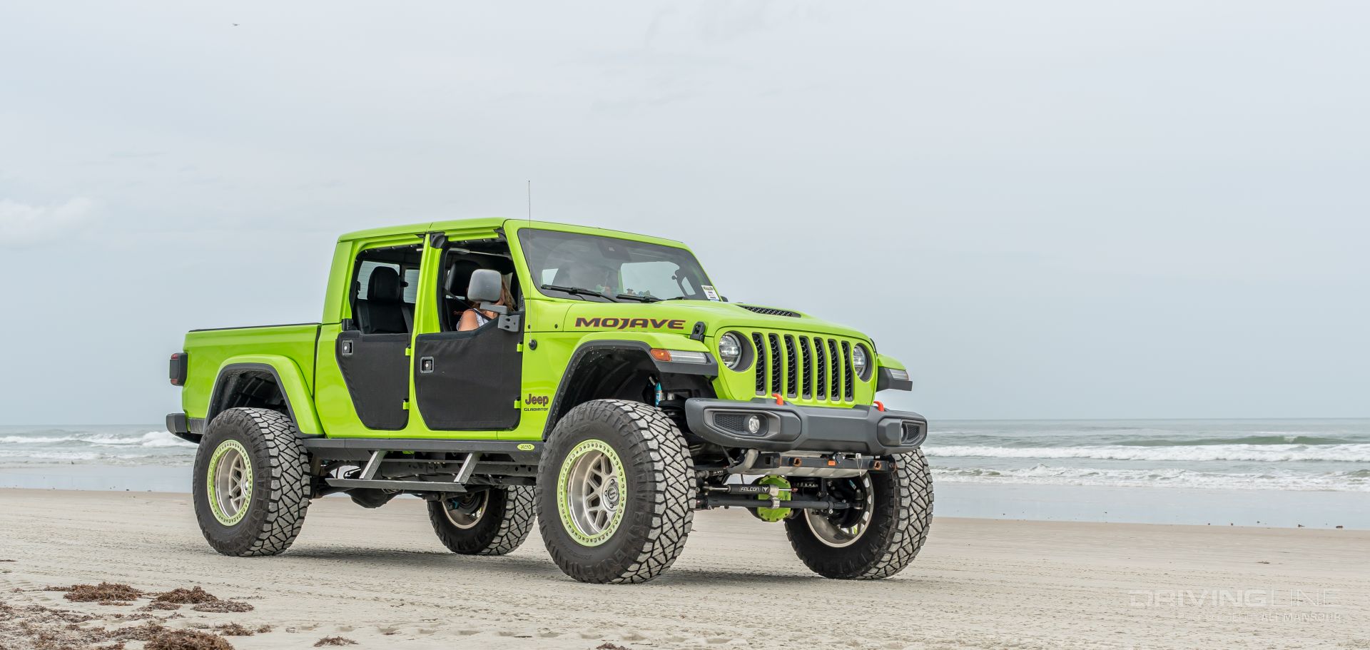 Lifted Jeep Gladiator Mojave green driving on Daytona Beach on Nitto Ridge Grapplers