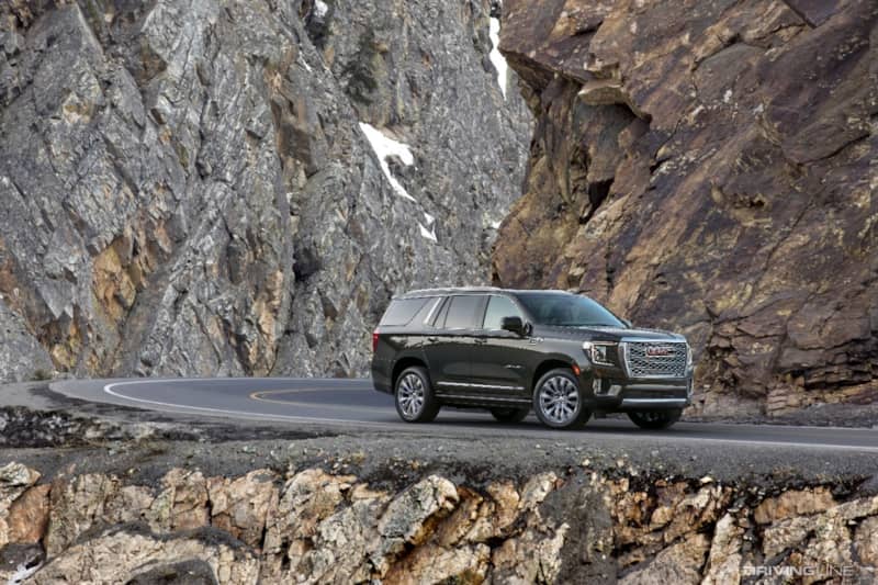 GMC Yukon Denali on cliff mountain road