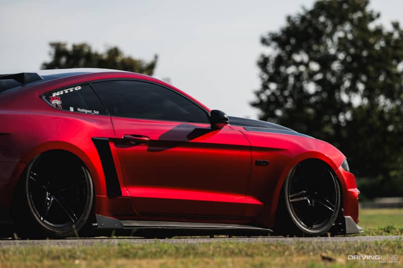 red, Bagged S550 Mustang GT rear 3/4 side view